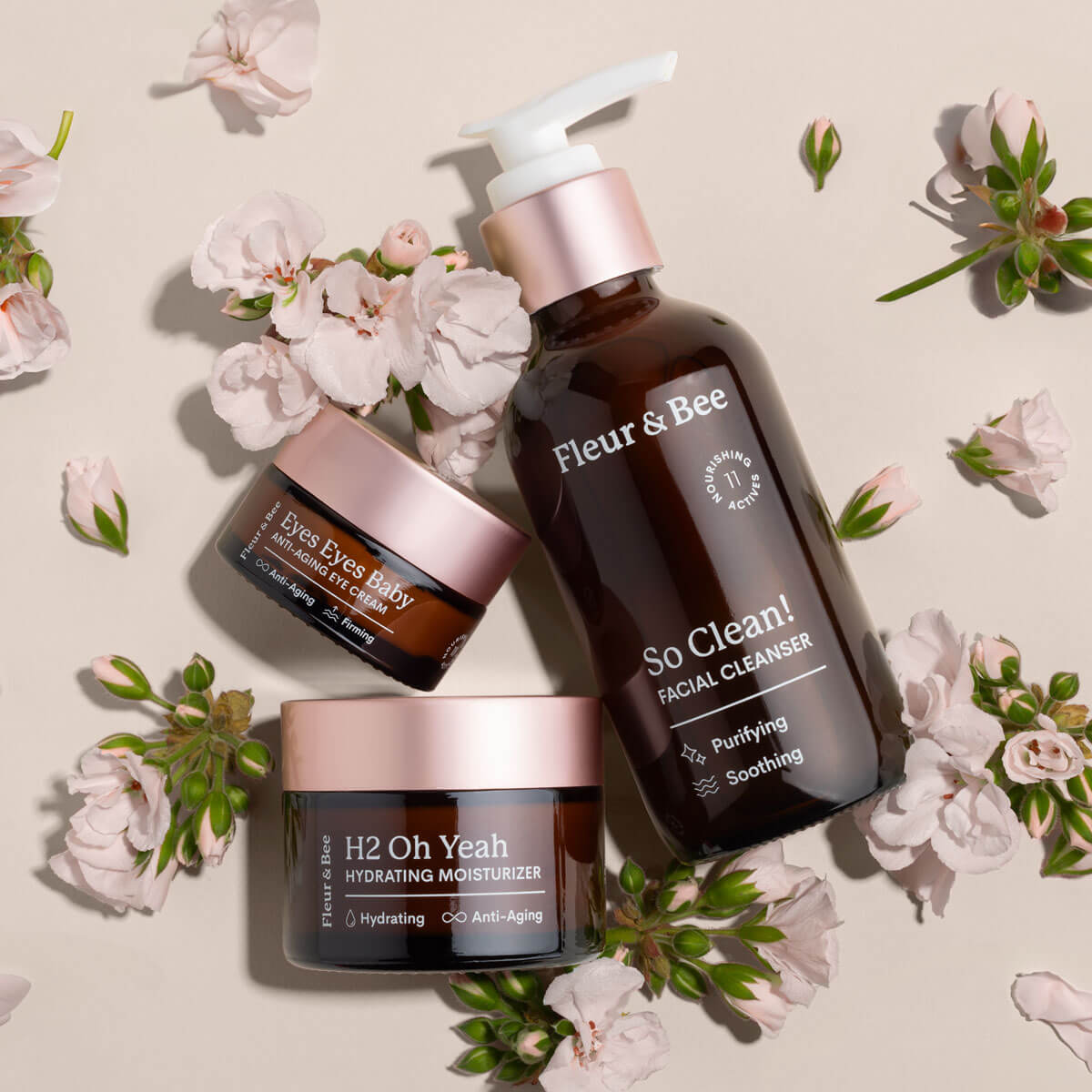 a cleanser, eye cream, and hydrating moisturizer surrounded by natural ingredients