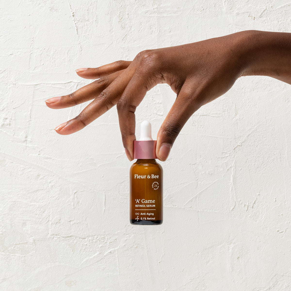 hand holding retinol serum