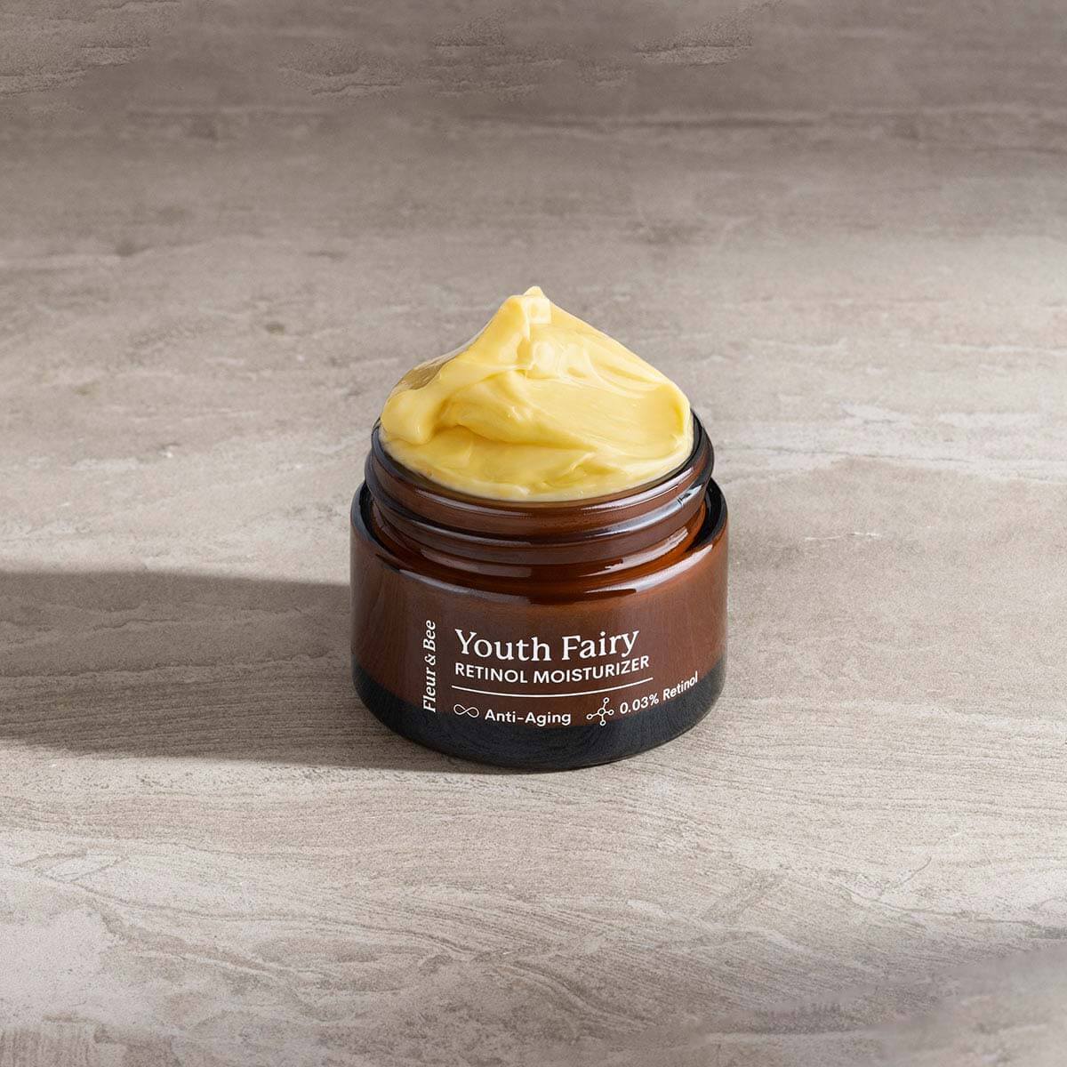 retinol moisturizer with open top showing texture of the retinol cream