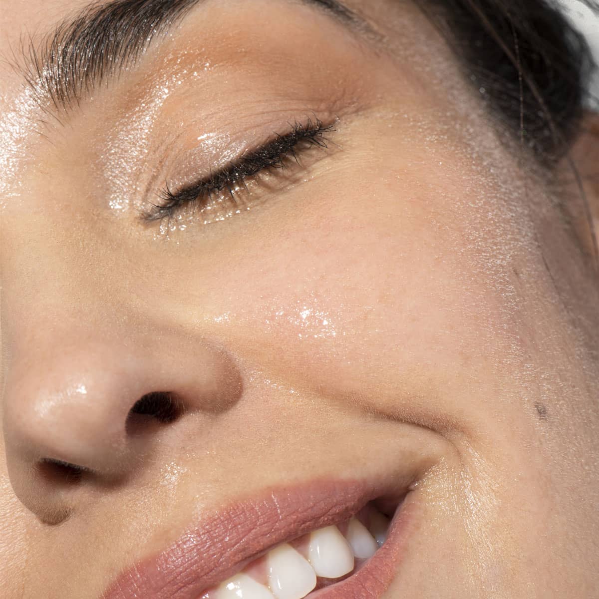 Woman using a rose water toner